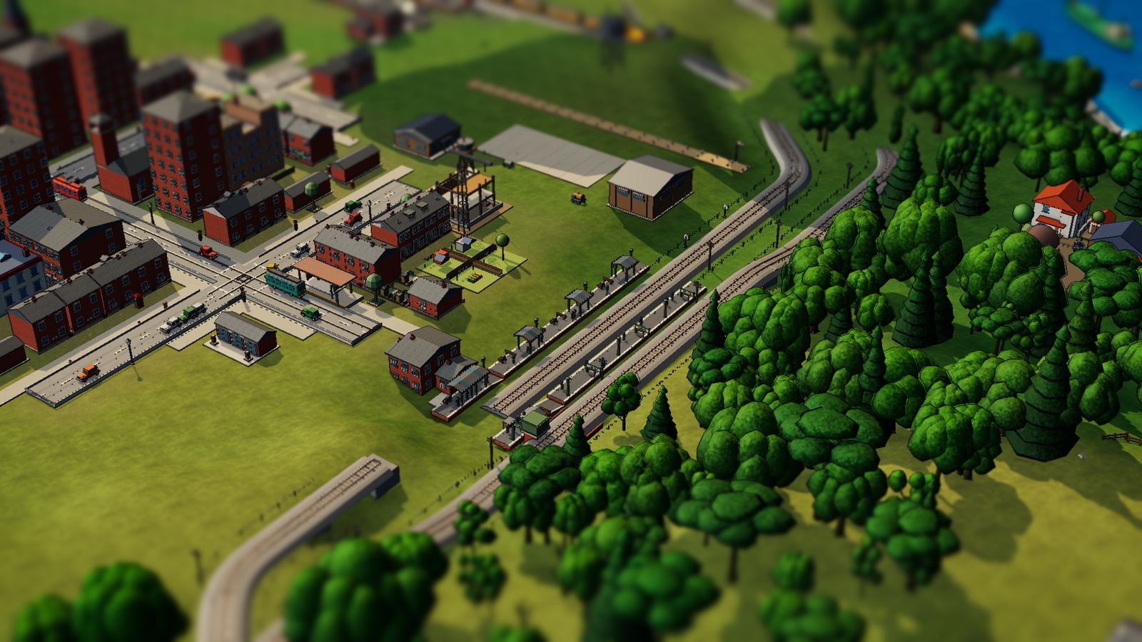 A station on the edge of town, with woods and the sea beyond.