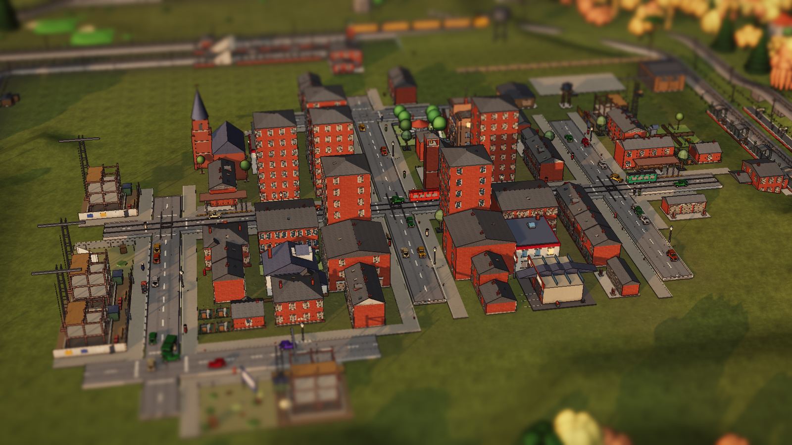 A brick town at dusk, lamps coming on, trains at the edge of town.